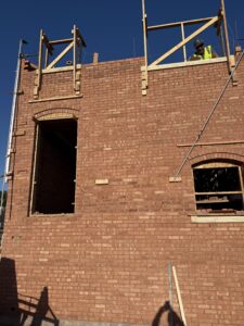 Side elevation of The Townsend in Edmond showing structural brick masonry and architectural details