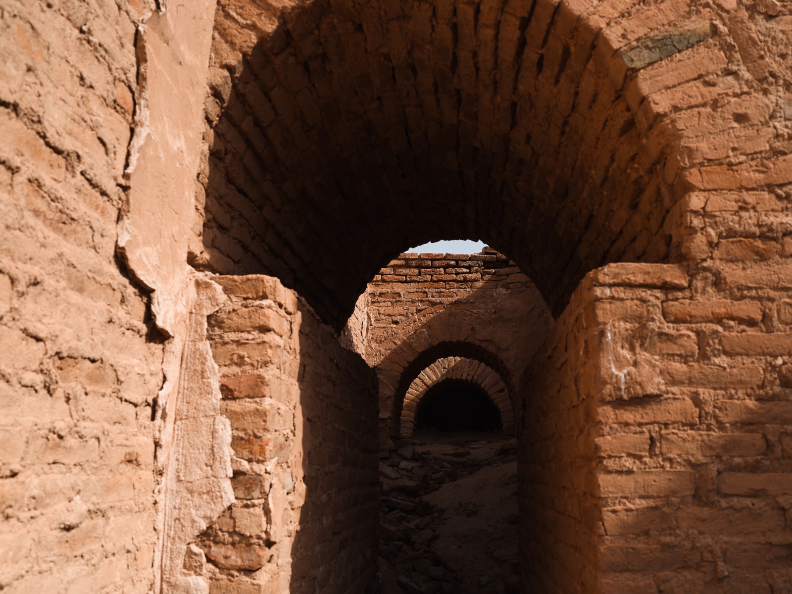 Ancient brick arches at an archaeological site in Iraq at sunset
