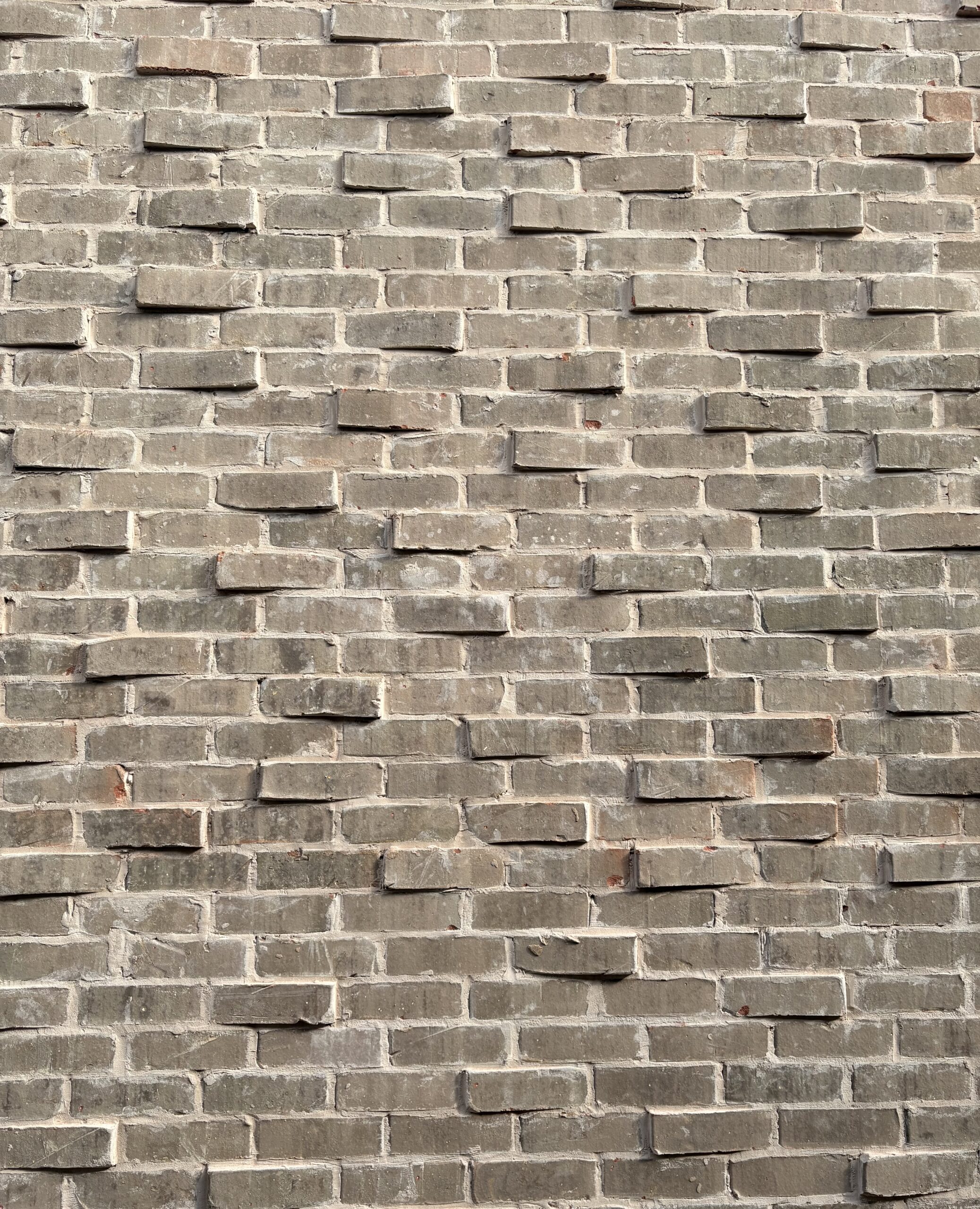 Close view of Mangum Brick Greystone and projecting brick faces